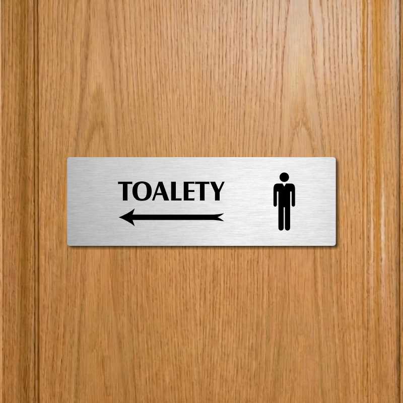 Toalety vlevo muži, 200x66mm, zlatá popiska s okrasným rámečkem  